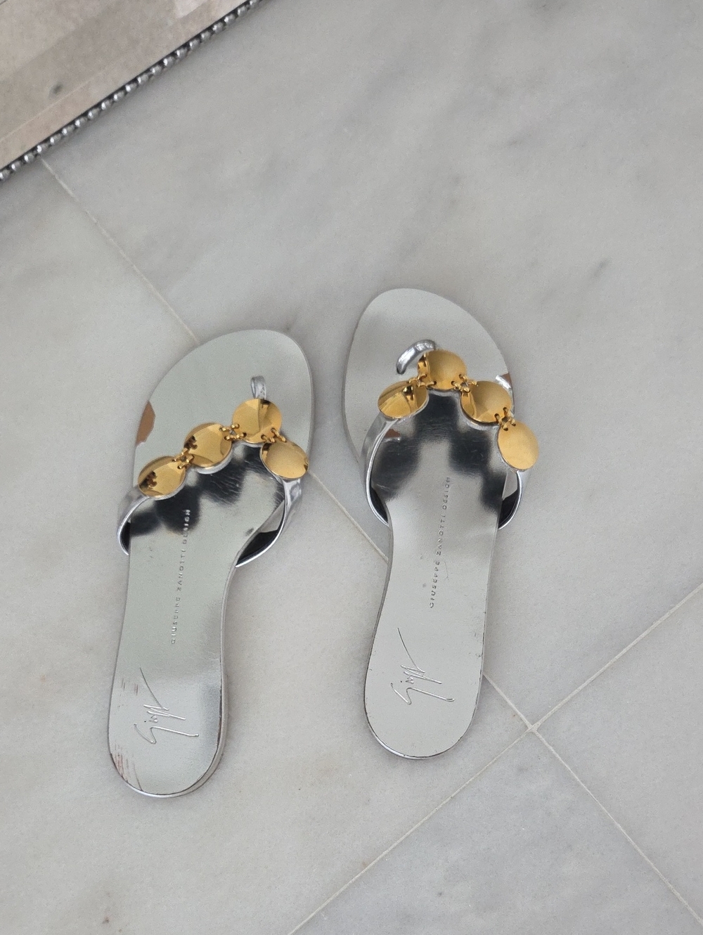 Giuseppe Zanotti Silver Leather Slides with Gold Disc Embellishments